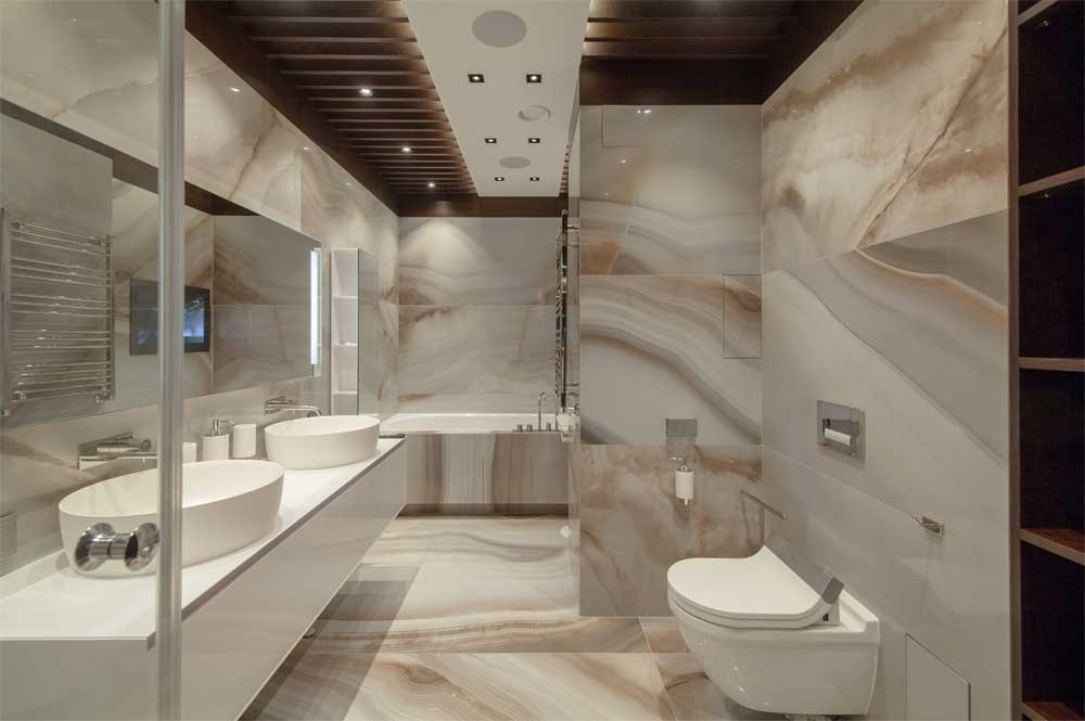Marble-effect bathroom with glass shower and wall-mounted toilet