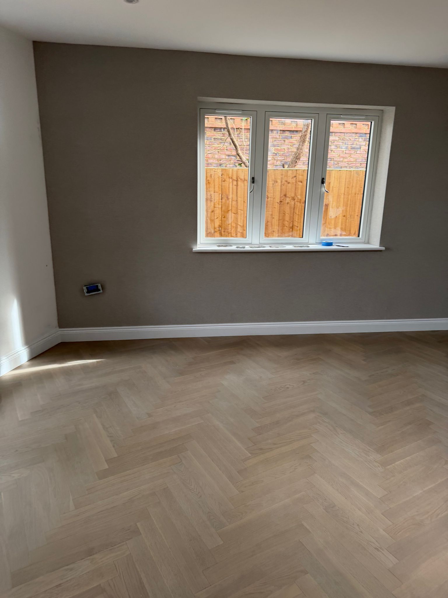 New pale timber floor in an unfurnished bedroom