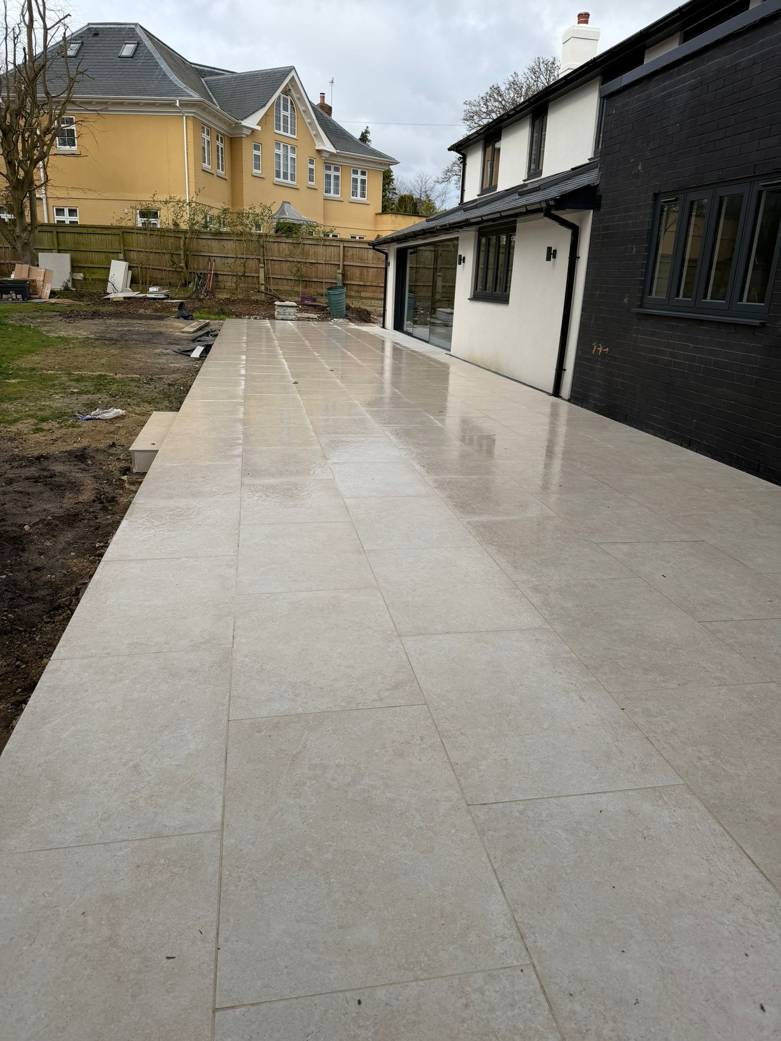 Large-format exterior paving laid along a rear terrace