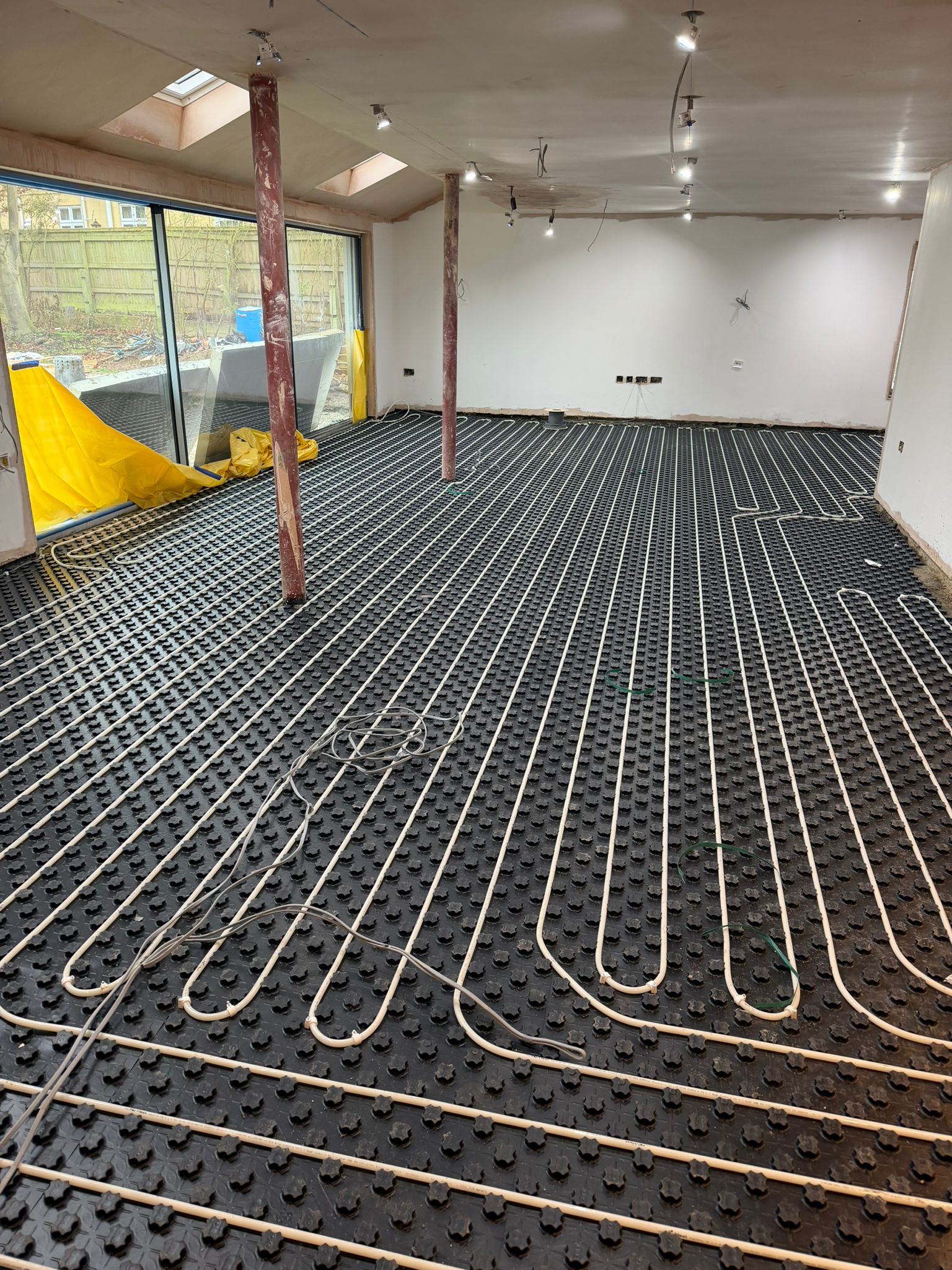 Underfloor heating system installed before the final floor finish